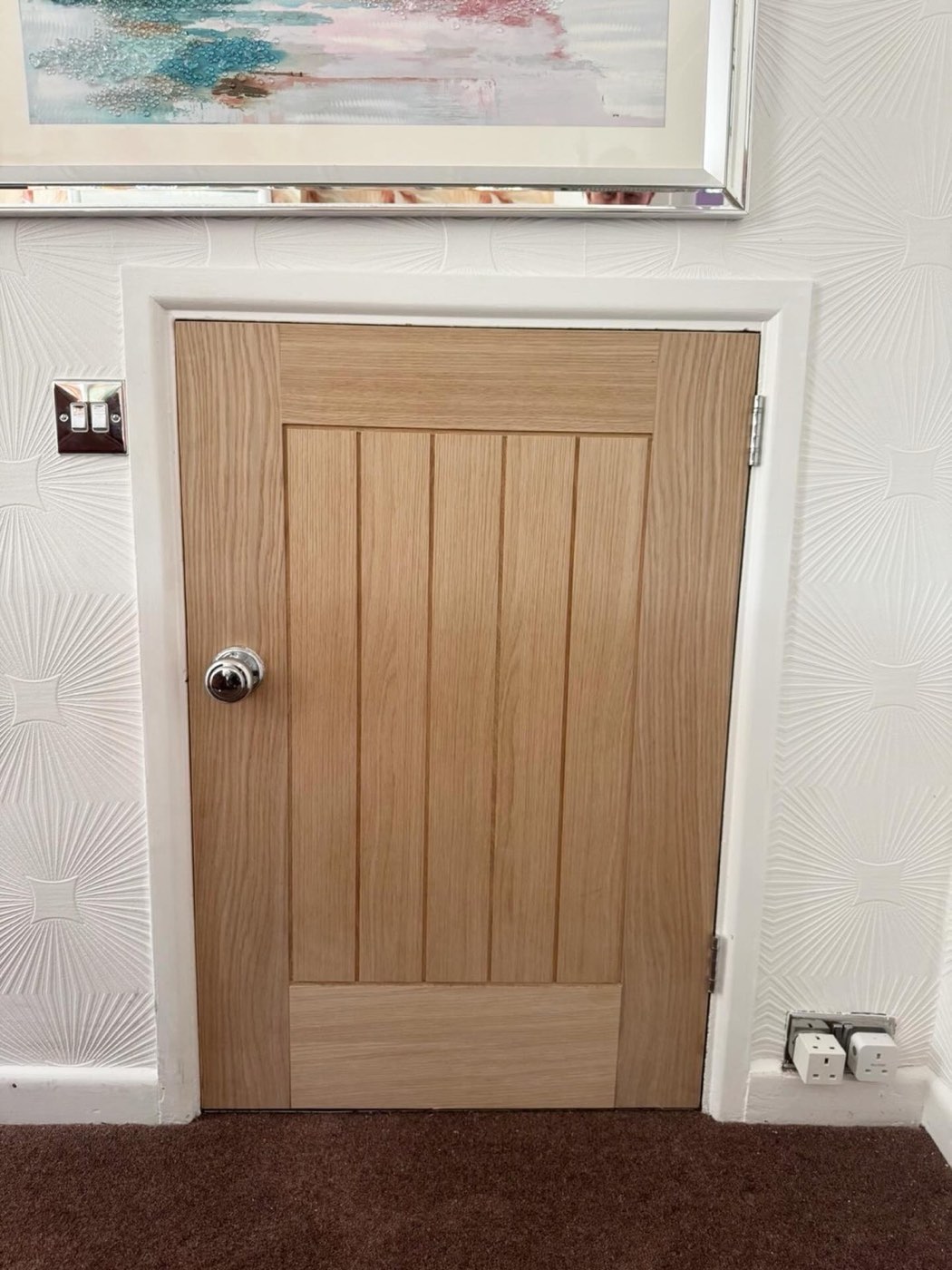 Bespoke oak under-stairs door