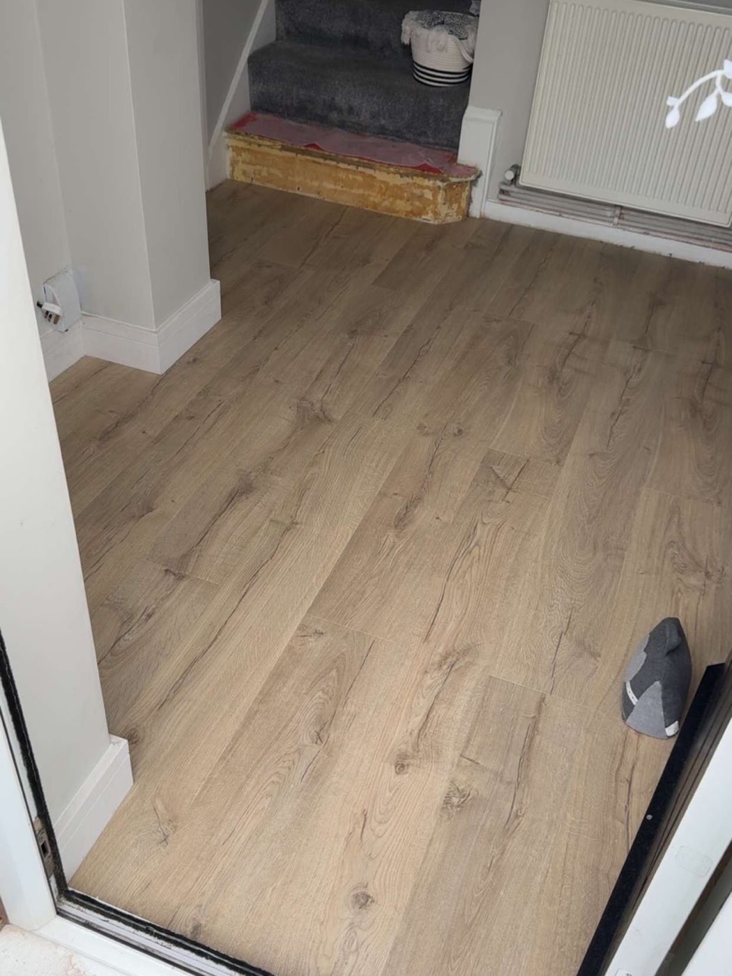 After: oak-effect flooring fitted through the hallway