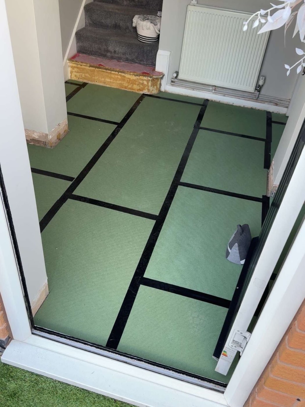 Before: hallway stripped back to underlay