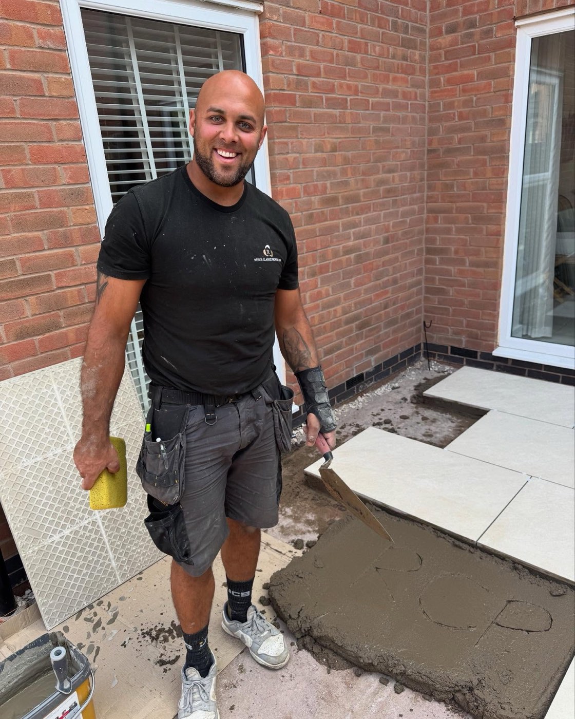 Reece laying a porcelain patio